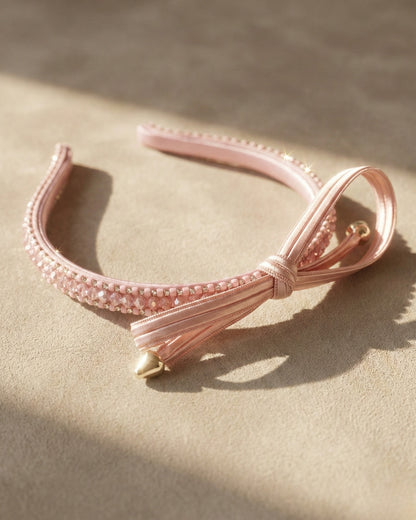 Chic Pink Twisted Bow Hairband with Sparkling Stone Embellishments