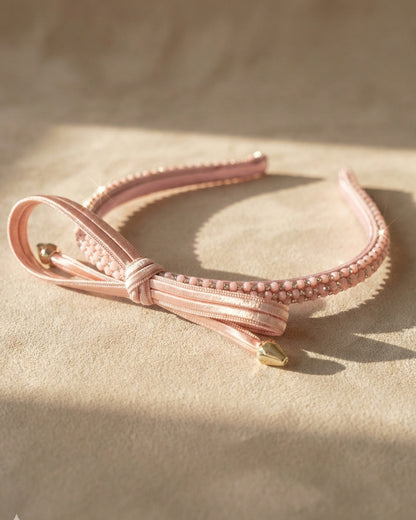 Chic Pink Twisted Bow Hairband with Sparkling Stone Embellishments