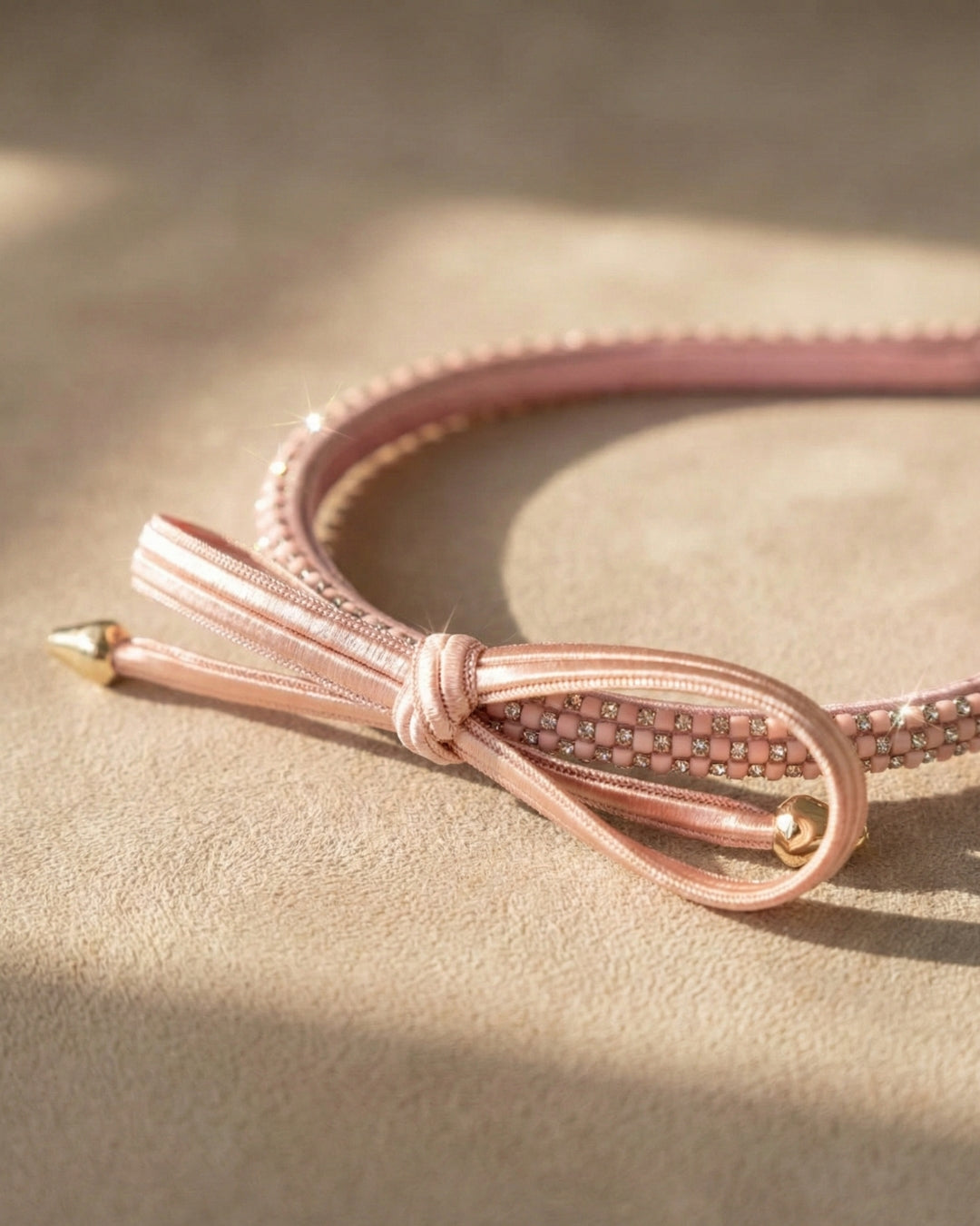 Chic Pink Twisted Bow Hairband with Sparkling Stone Embellishments